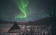 Lappish hut under Northern Lights Lappish hut under Northern Lights