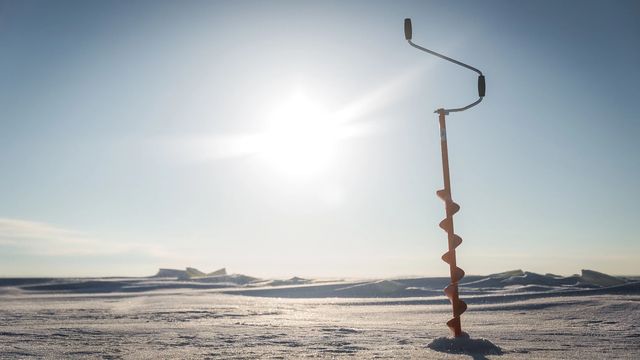 Ice fishing in a Secluded Frozen Lake