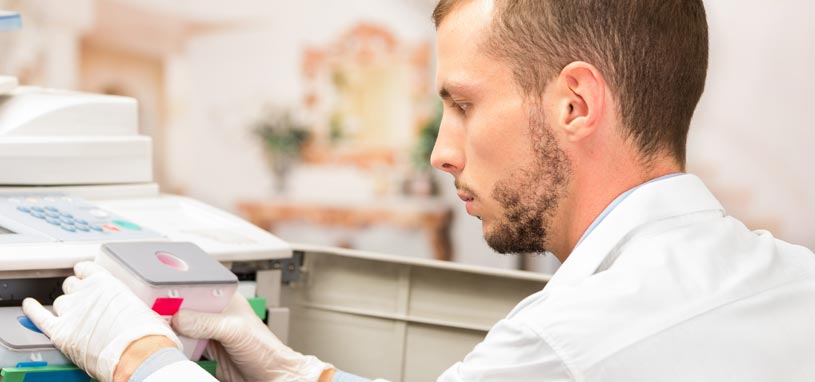 printer repair man replacing toner cartridge