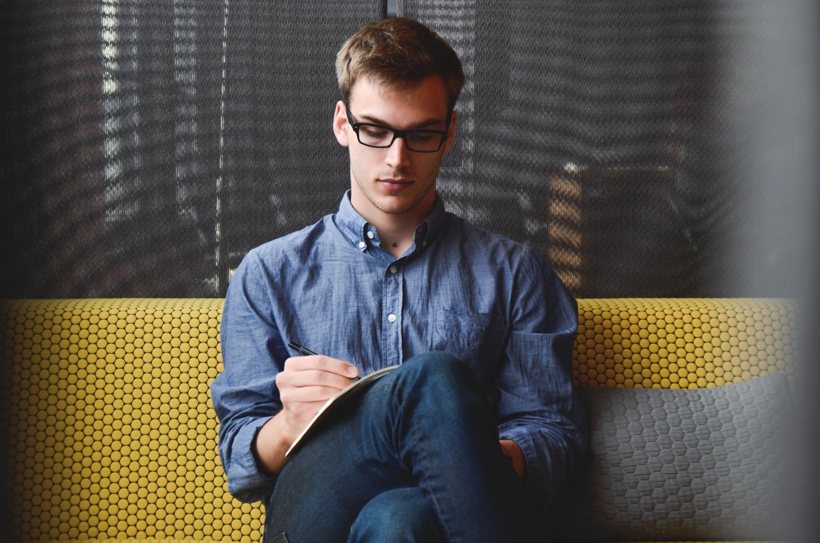 Young man studying business English online