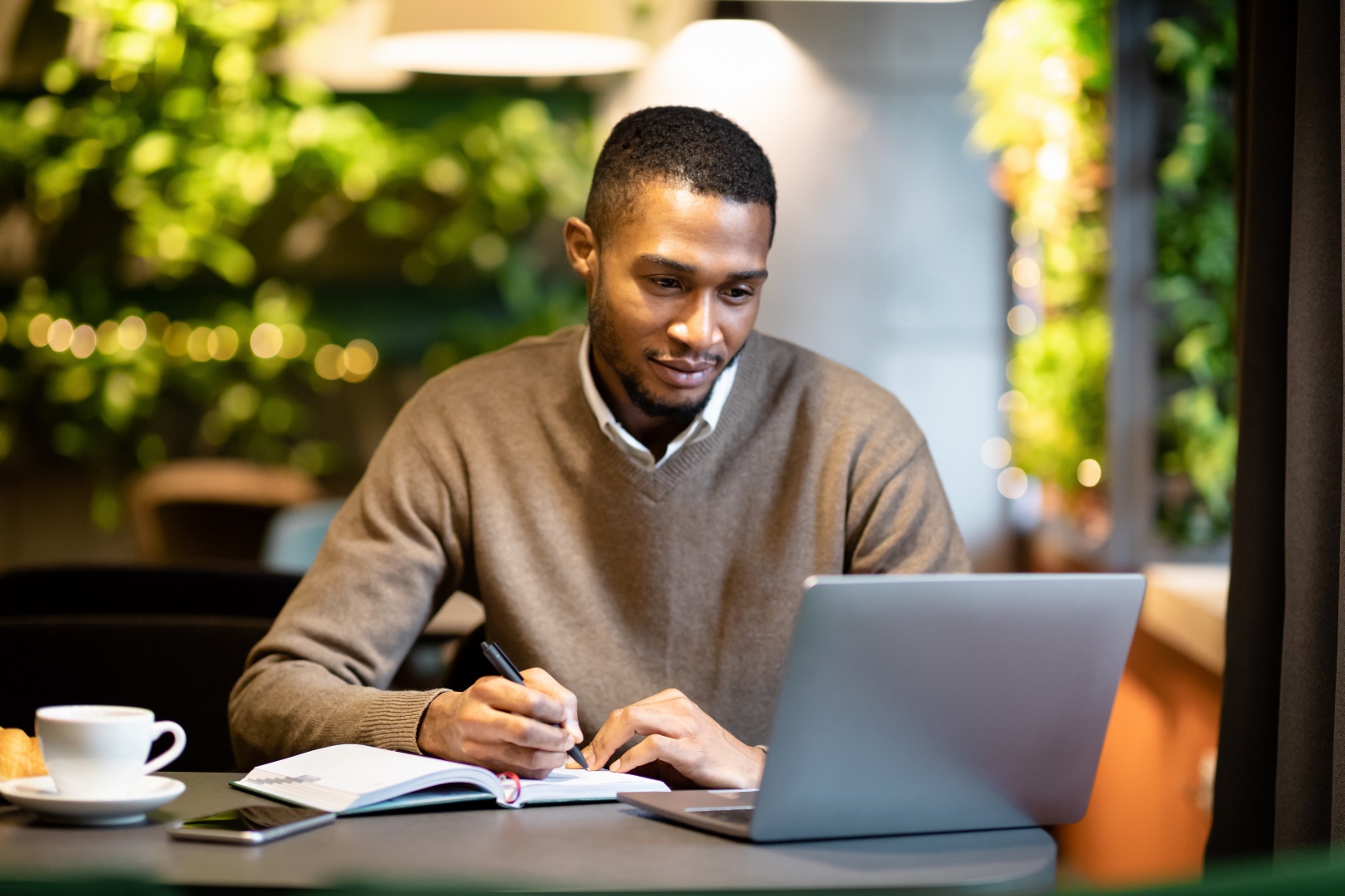 Young man studying English online