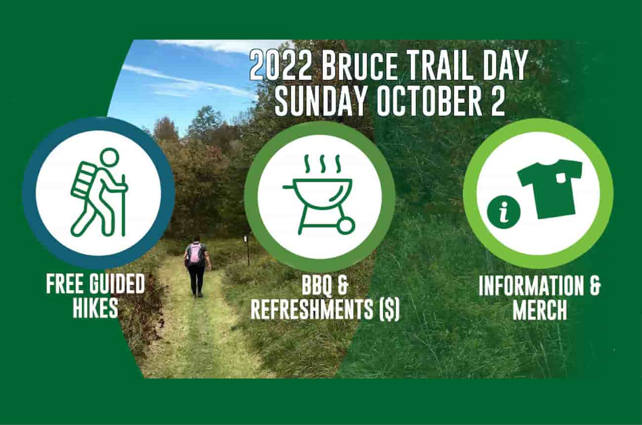 Person hiking on a section of the Bruce Trail. Text: 2022 Bruce Trail Day October 2. Free guided hikes, paid BBQ & refreshments and information & merch