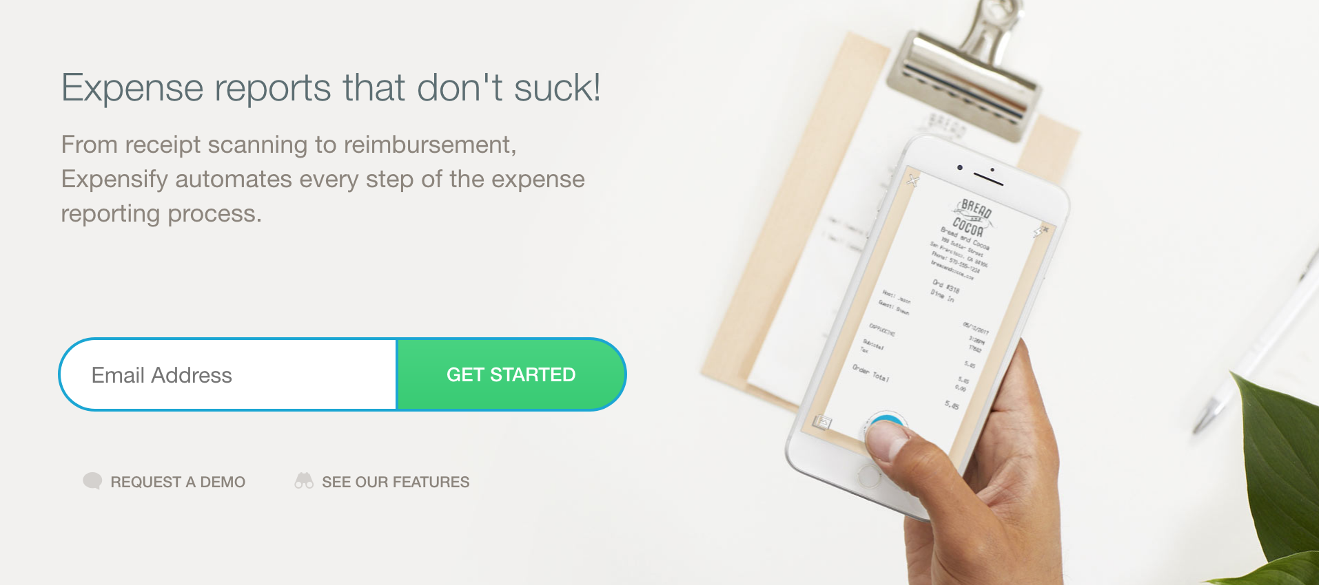 A screenshot of Expensify's homepage showing the tagline, "expense reports that don't suck!"