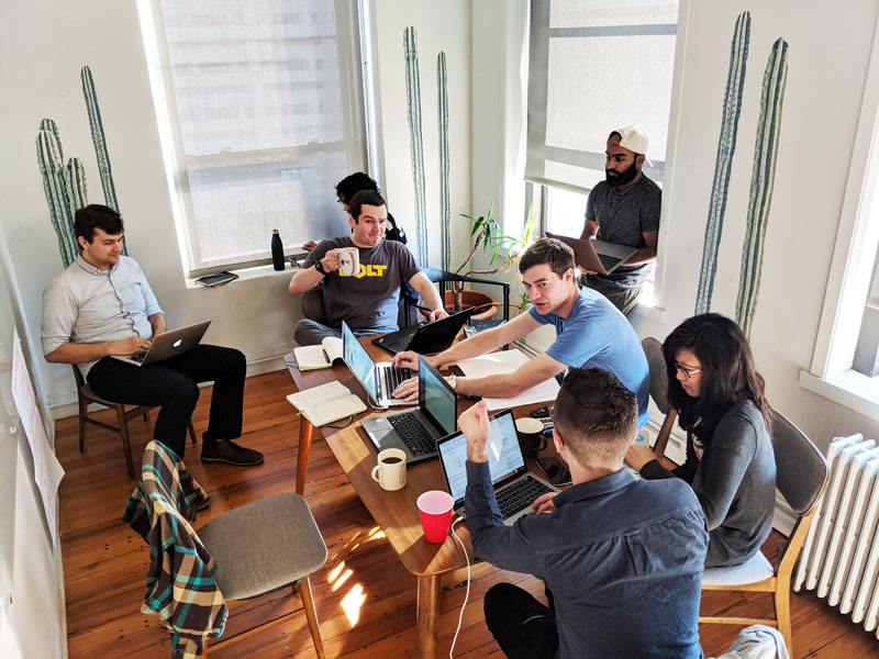 Appcues' product team sitting around a conference table for User Testing Day