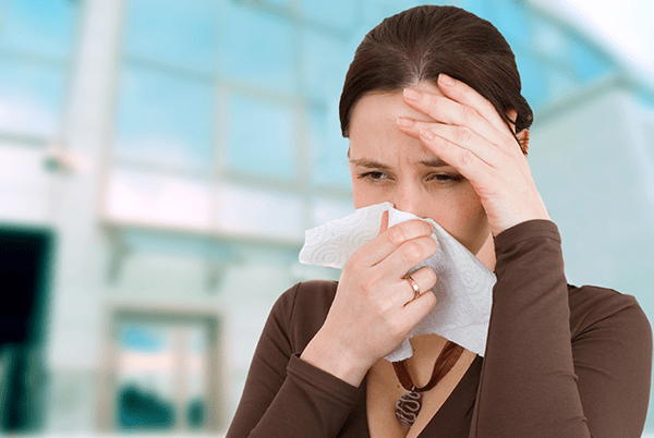 Woman suffering because her allergies are in control of her life.