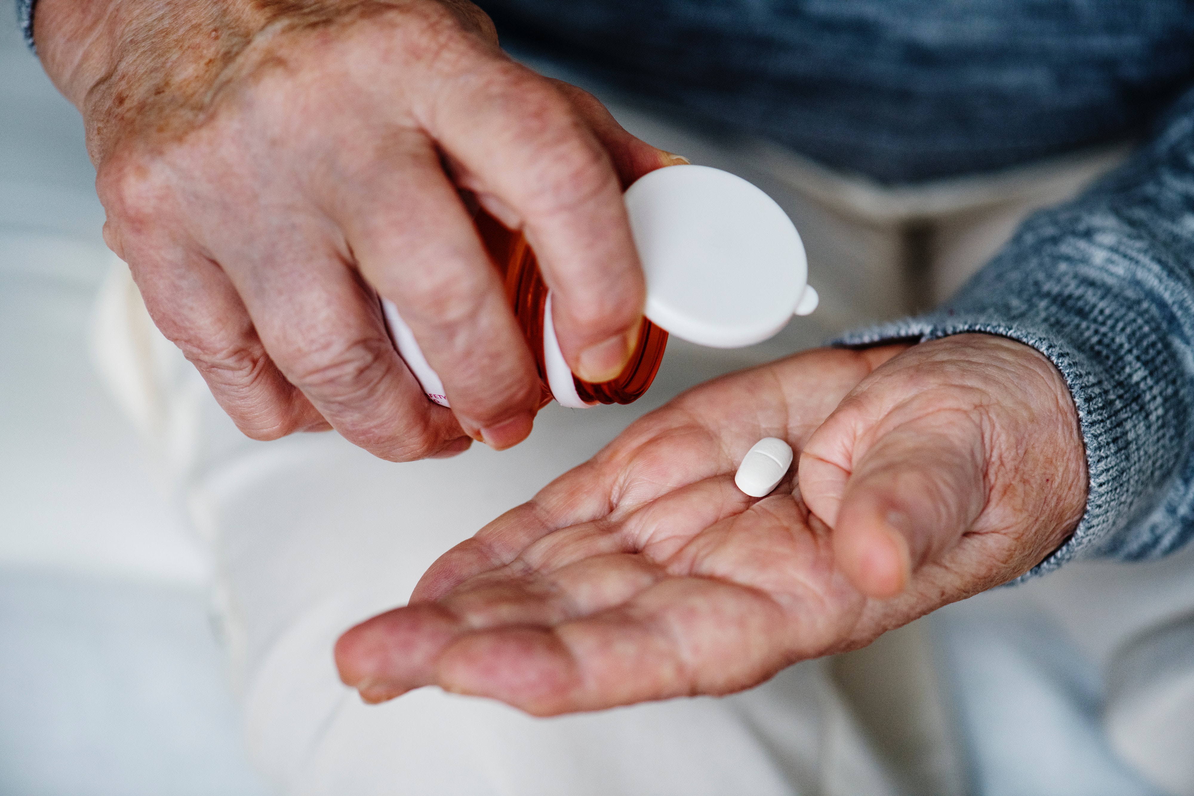 Man Taking Prescription Pills