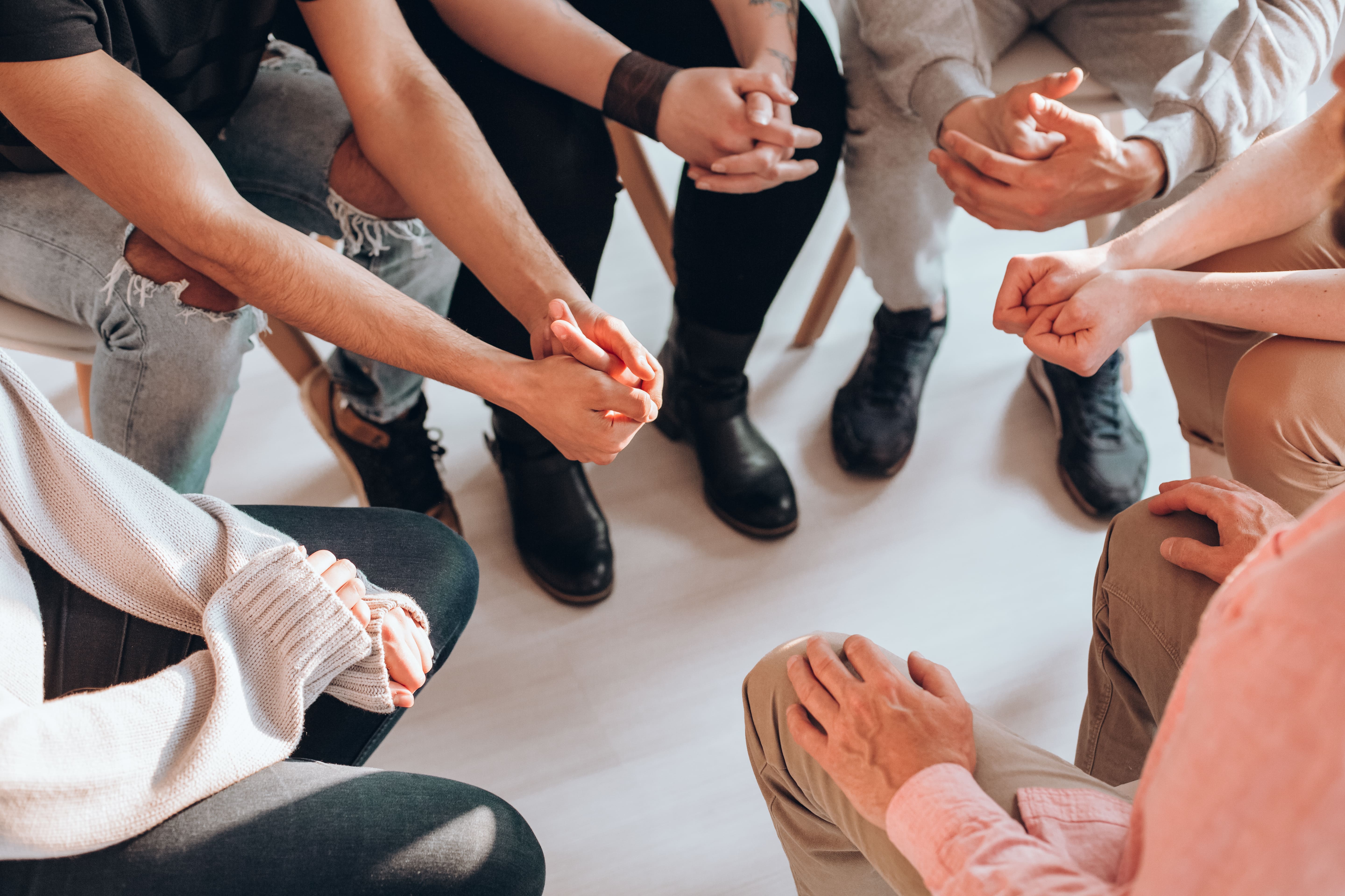 Support Group with Hands Together