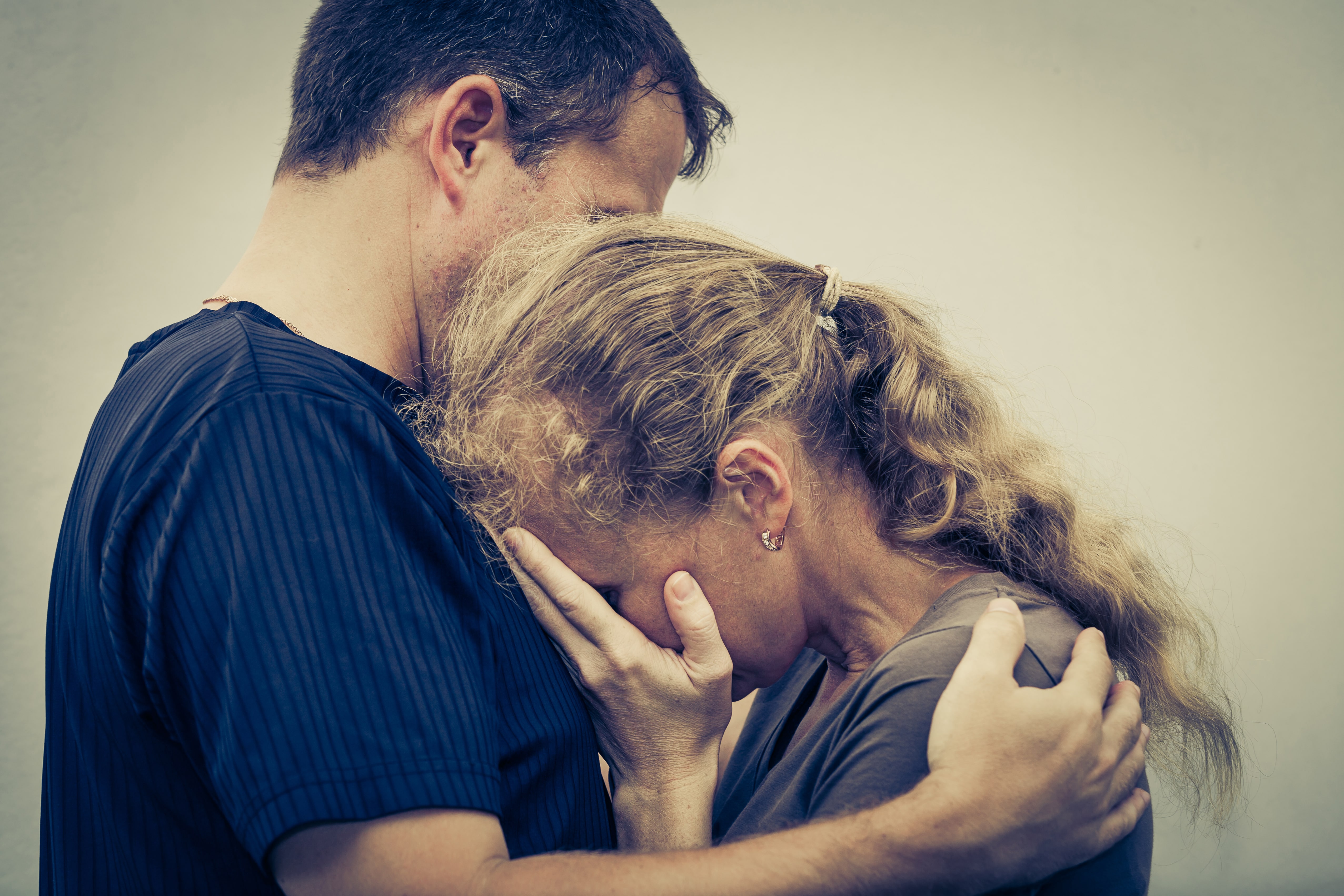 Man Consoling Crying Woman