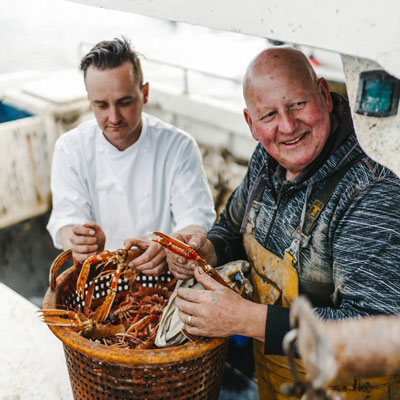 Head Chef Michael Leathley with langoustine fisherman Hughie Macleod
