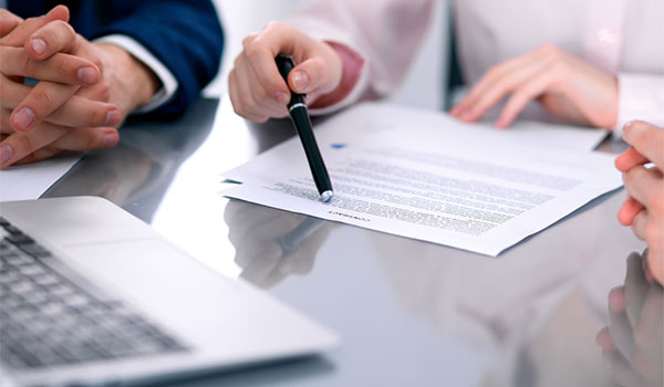 People around a table going through some documents