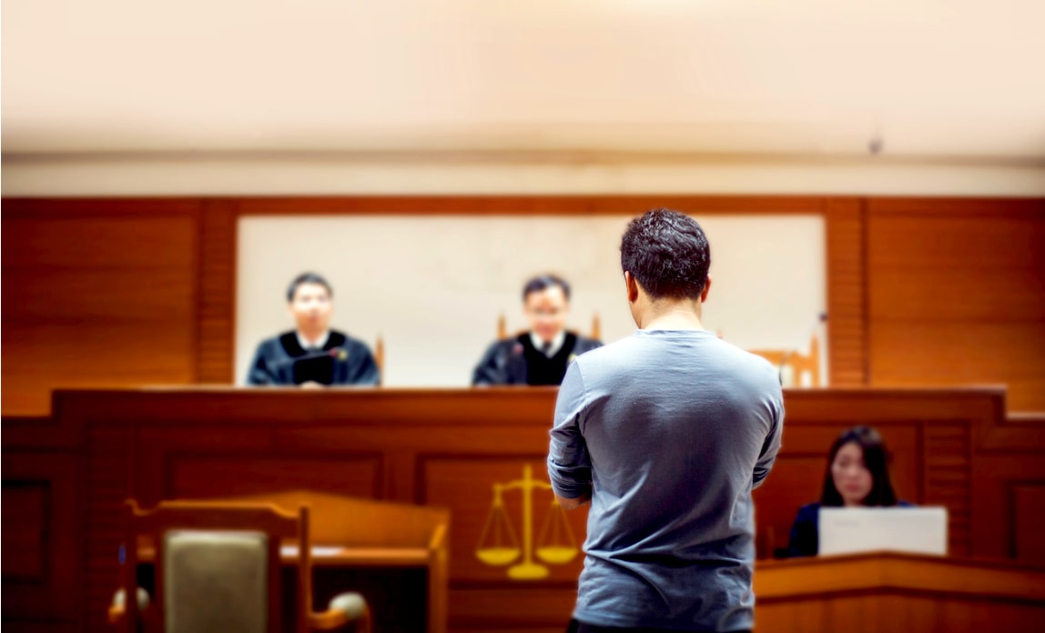 Judges attend to a hearing in a court