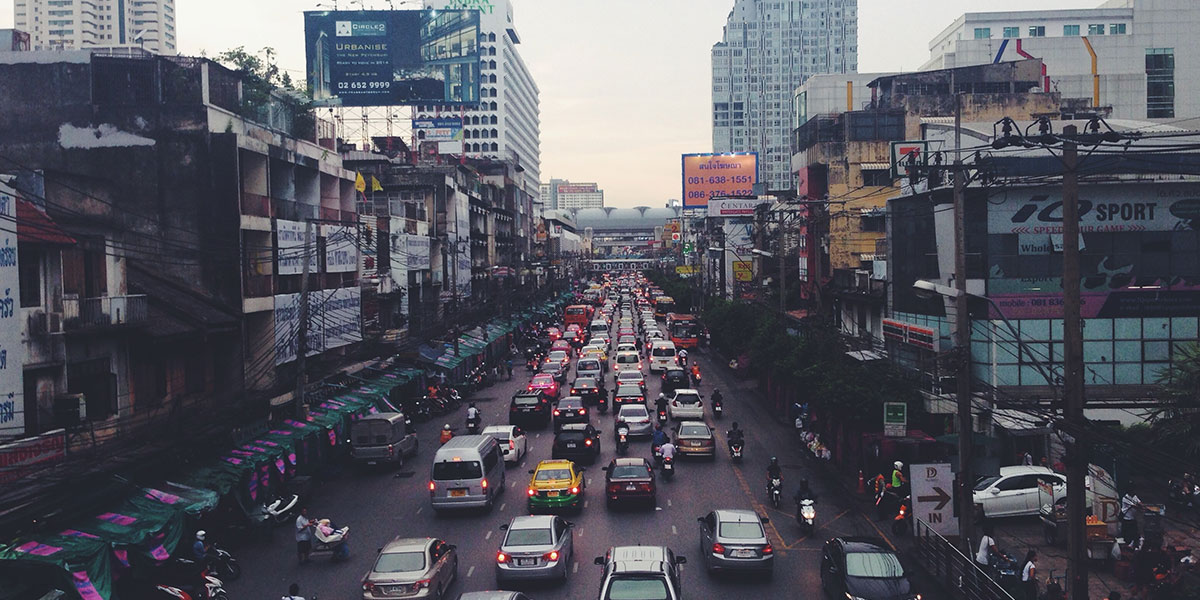 A busy City street full of cars