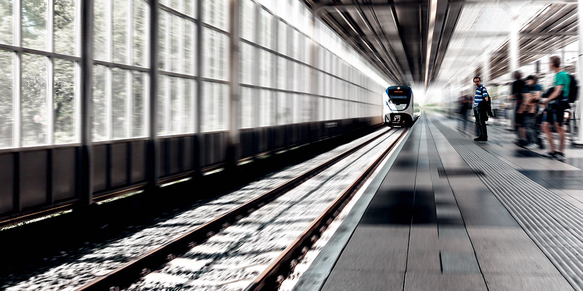 A modern train pulling into a Station