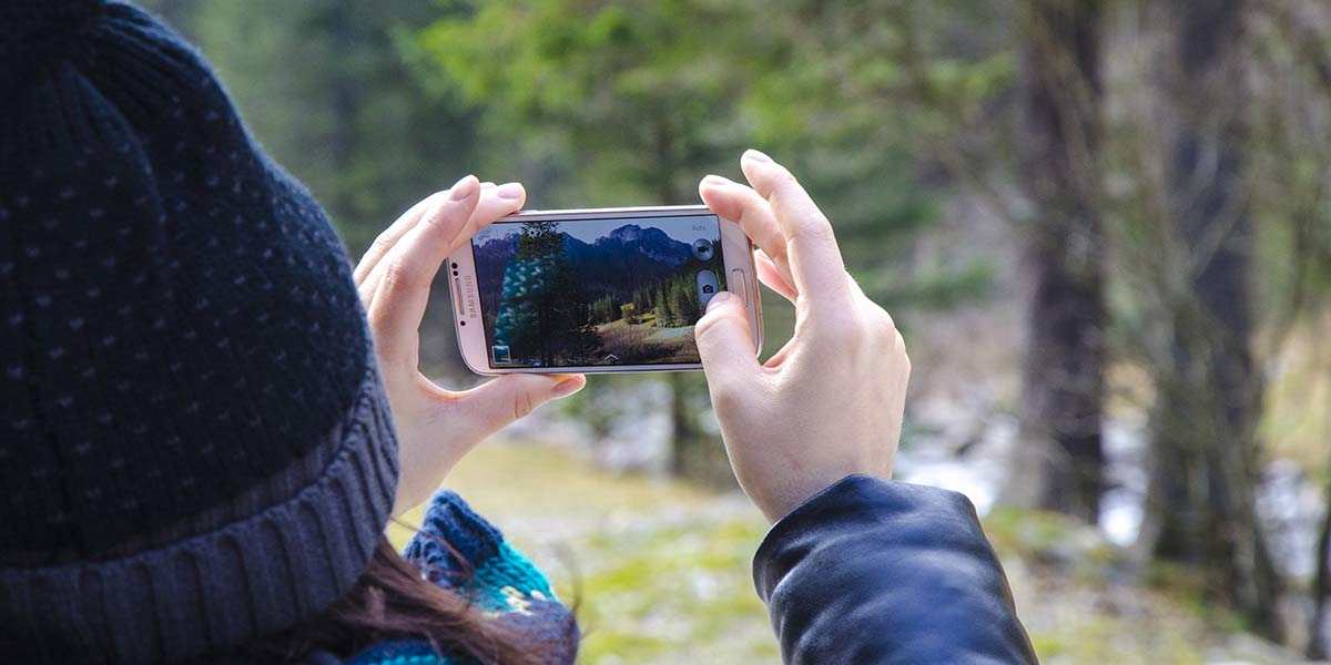 A person using a phone to take pictures