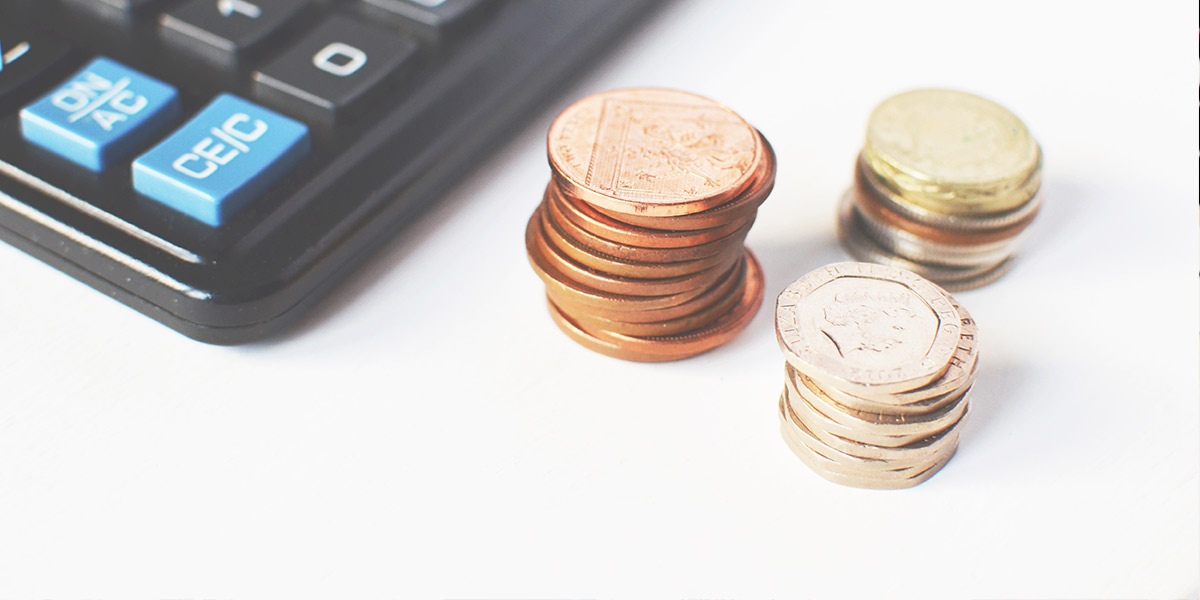 Stacks of diierent coins on a desk