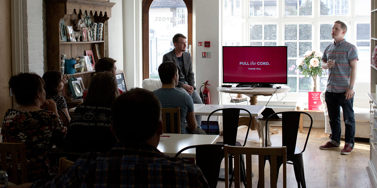 A person holding a Developer seminar in The Oldpost cafe