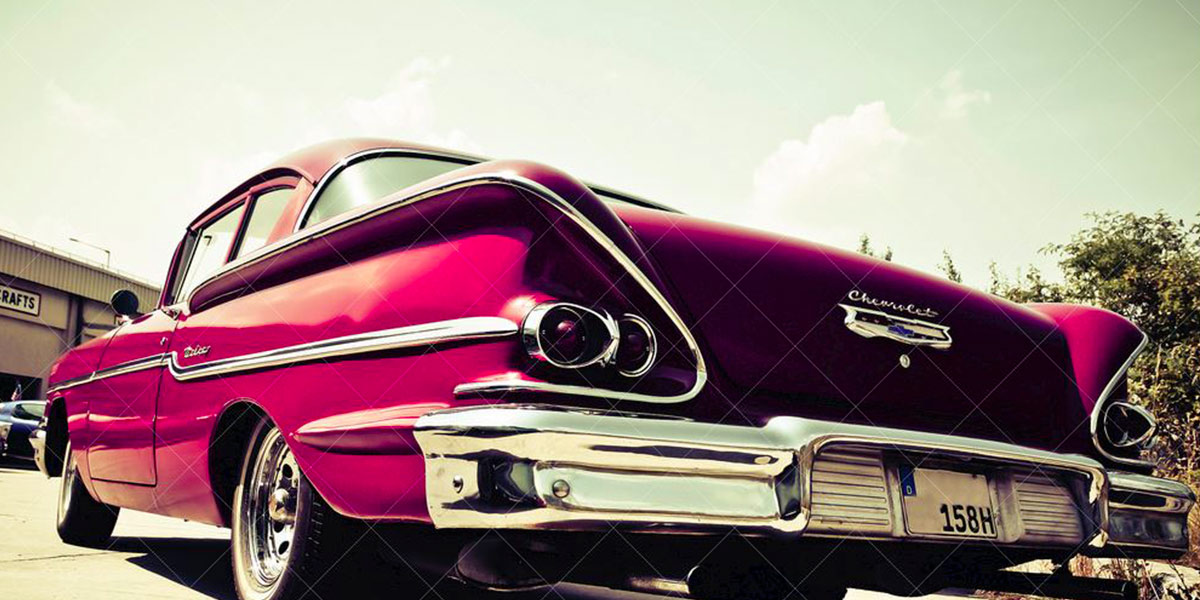 The rear of a large 1950's American car