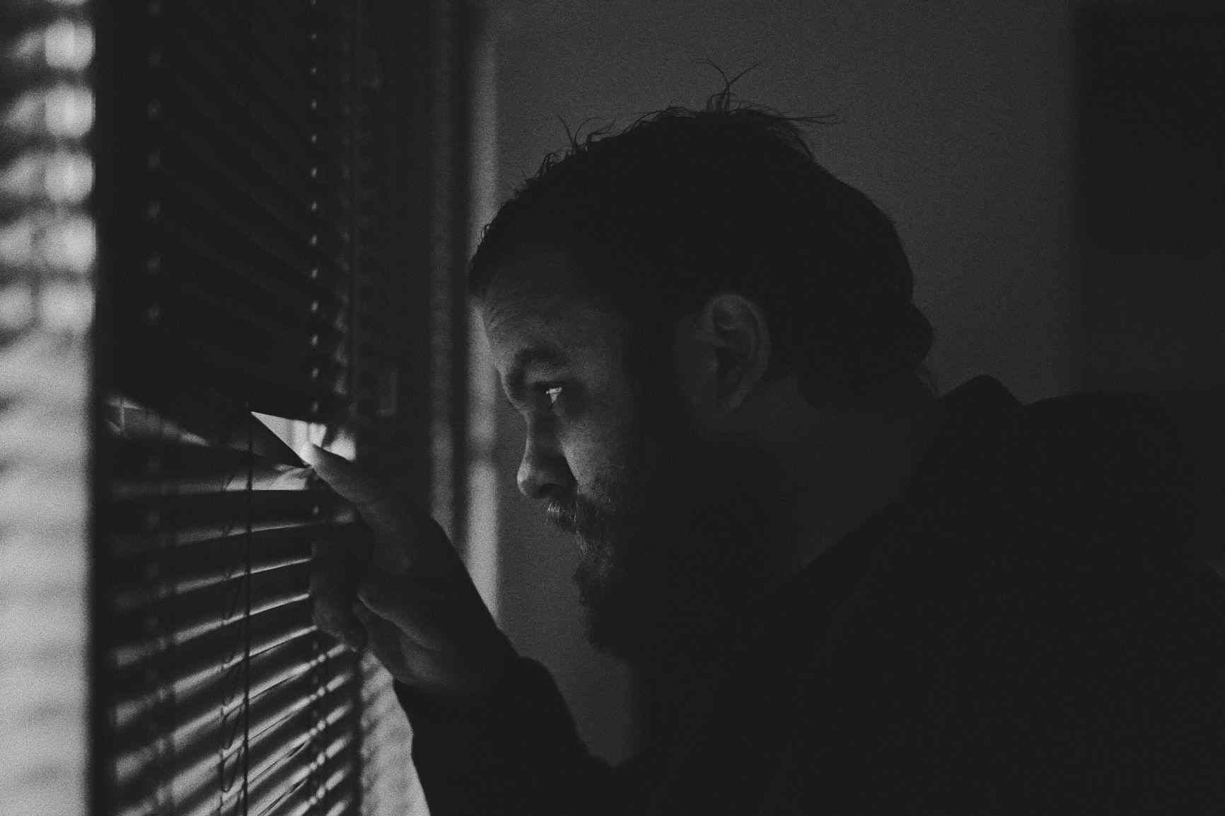 Man checking who's at the door