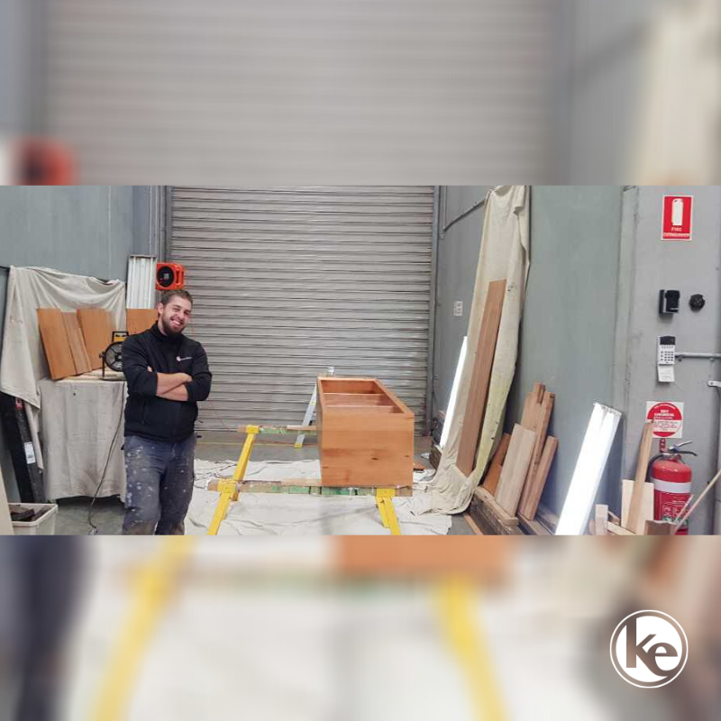 Commercial electrician doing electrical safety inspection in factory