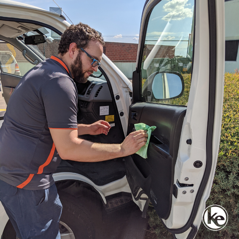 Electrician disinfecting their work vehicle during COVID pandemic