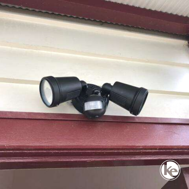 Twin sensor spot light security lighting on outside of house