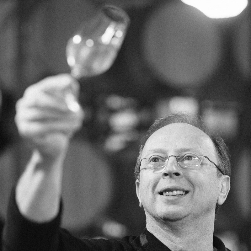 Claude looking a glass of sparkling wine Thibaut-Janisson Winery