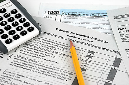 1040, calculator, and a pencil