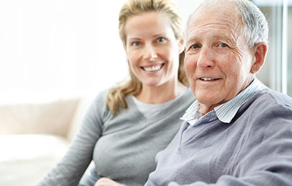 Father and daughter sitting next to each other