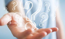 Hand holding question mark symbols