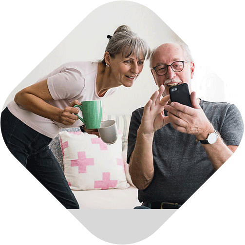 Senior couple using mobile phone