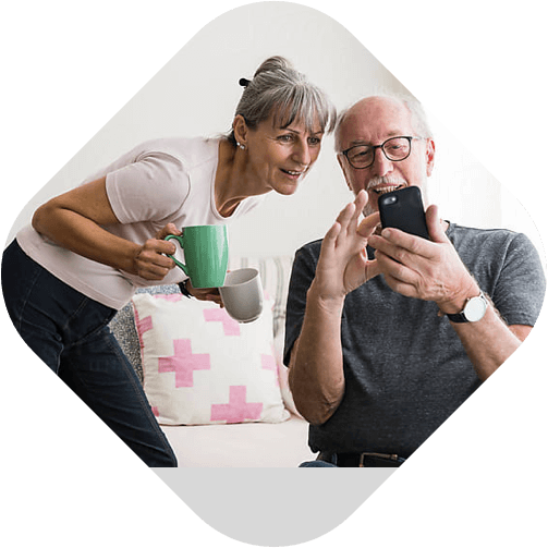 Senior couple using mobile phone