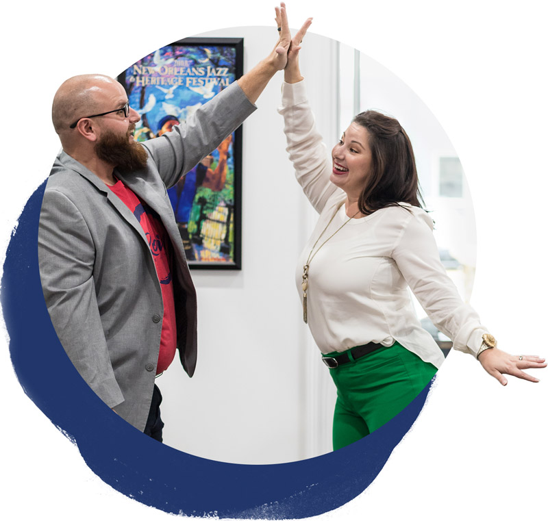 The Robin Realty team celebrating with a high-five