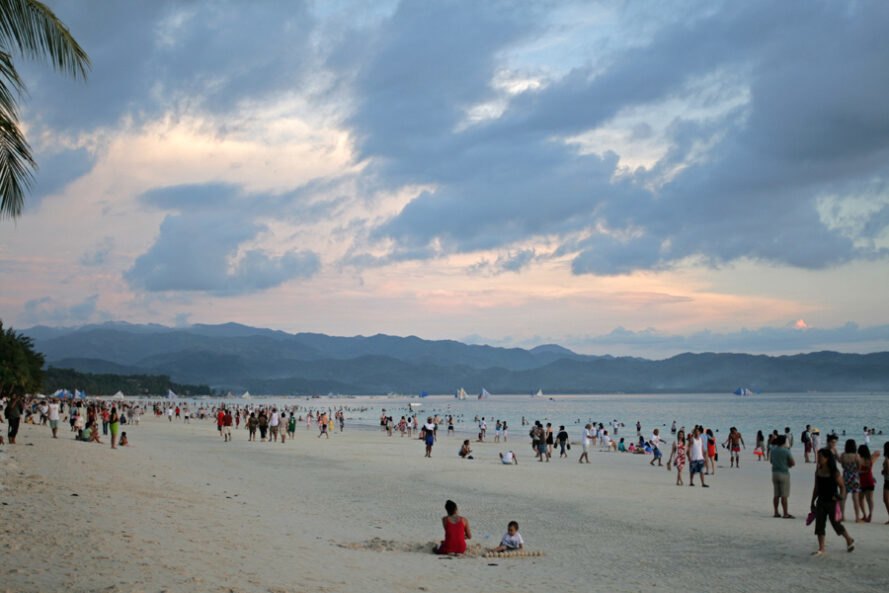 tourists covering a beach the Philippines