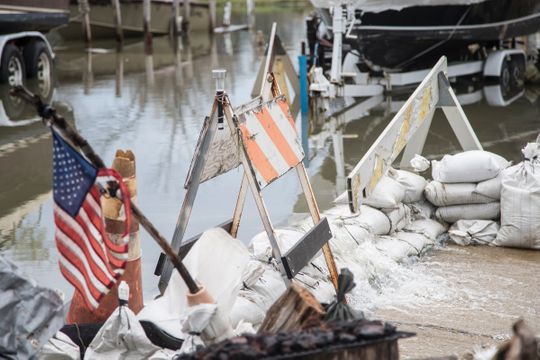 Sandbags have been laid in front of a house on Klenk Island in the Jefferson Chalmers neighborhood in Detroit to prevent water from flooding the houses across street, Wednesday, May 1, 2019.