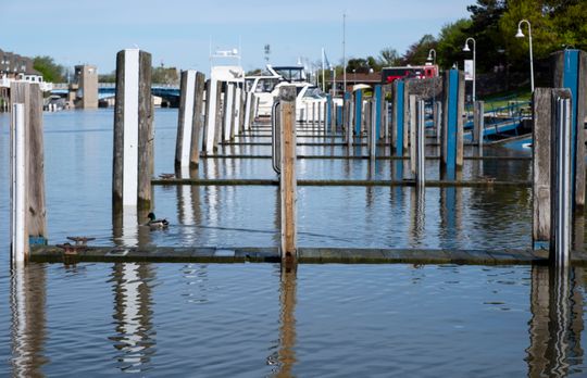 The surface of the Black River in Port Huron almost reaches the top of docks in River Street Marina Tuesday morning, May 21, 2019.