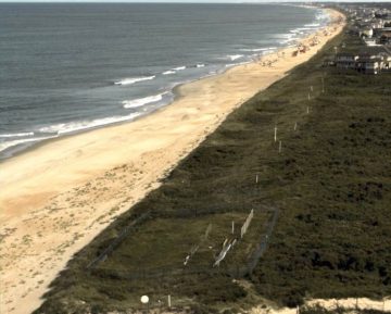 Looking south from the Field Research Facility. Approximately a quarter mile of open beach is seen. Photo, USCOE