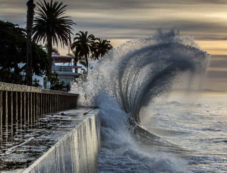 High tides batter the seawall at Butterfly Beach in Santa Barbara, California.