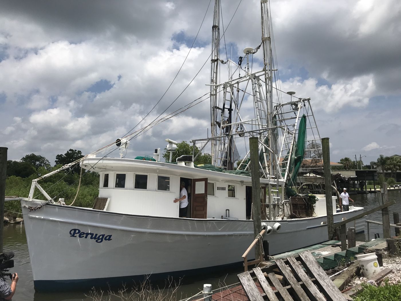 Captain George Barisich brings his boat, the Peruga, into his dock after spending days on the water catching shrimp. He bought this boat in 2009, and, in addition to commercial fishing, he does tourist shrimping trips, taking people out on the water to learn about the trade. (Jamie Grey/InvestigateTV)