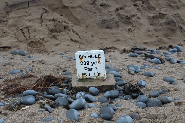 The marker stone for 8th hole was pictured on the beach after storms in January 2018