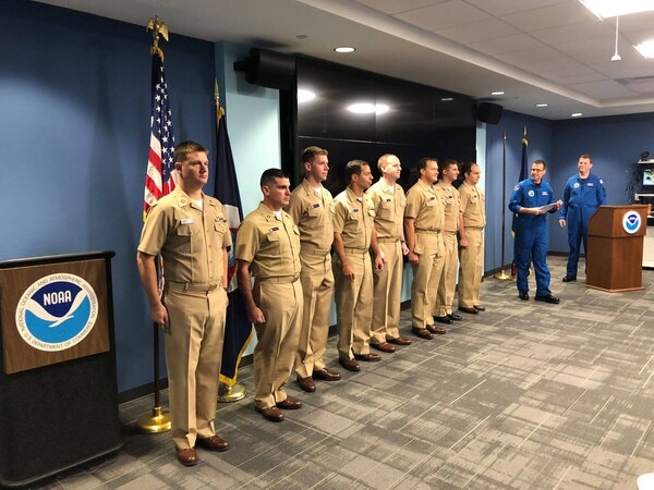 On Oct. 1, the NOAA Aircraft Operations Center held a pinning ceremony for NOAA Commissioned Officer Corps officers promoting to the next grade. In the middle, Lt. Samuel Urato put on lieutenant commander. (NOAA)