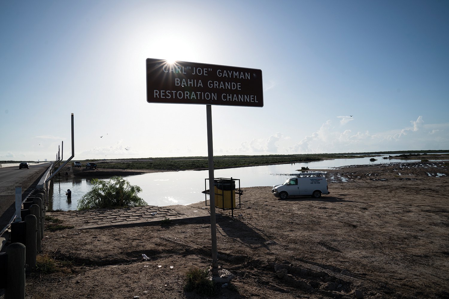 Anglers fishing at a restoration channel cut in 2005 to reconnect the Bahia Grande to the ship channel