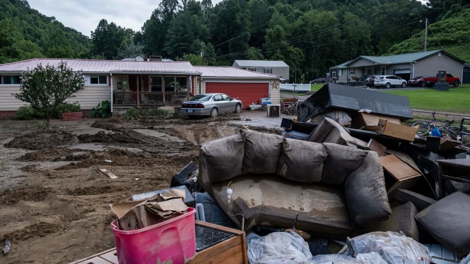 Water-damaged items sit outside a house in Squabble Creek, Kentucky, on July 31, 2022, after historic flooding in Eastern Kentucky.