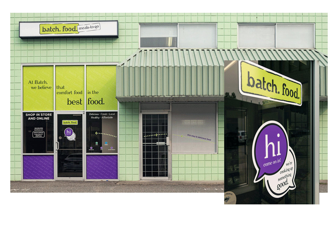 Photo of the Batch store exterior with new signage. The green building has new decals on the windows that include food icons, store hours and contact details.
