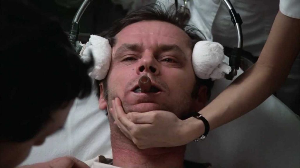 man in pain while receiving ECT in the past