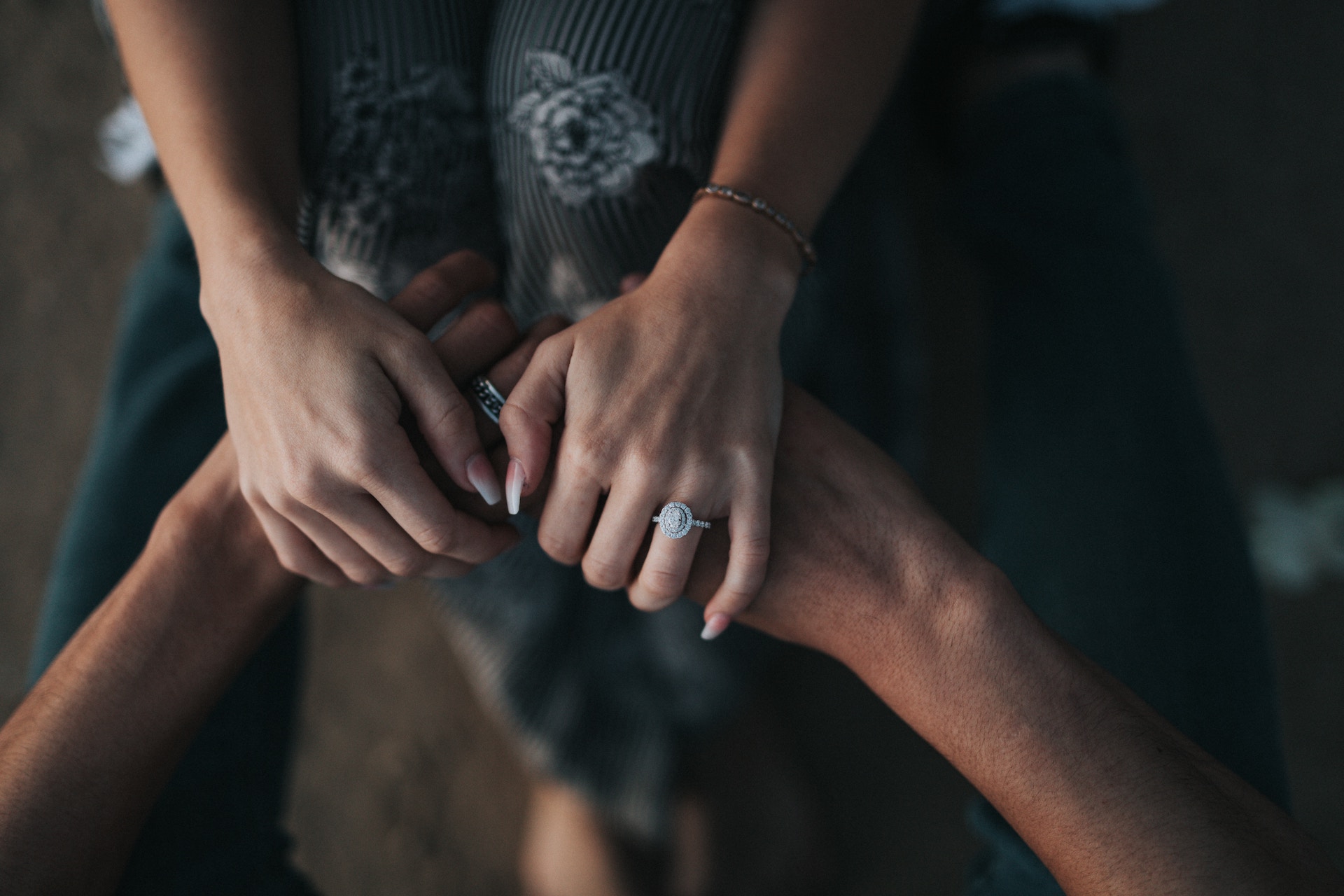girl holding other person's hands in support