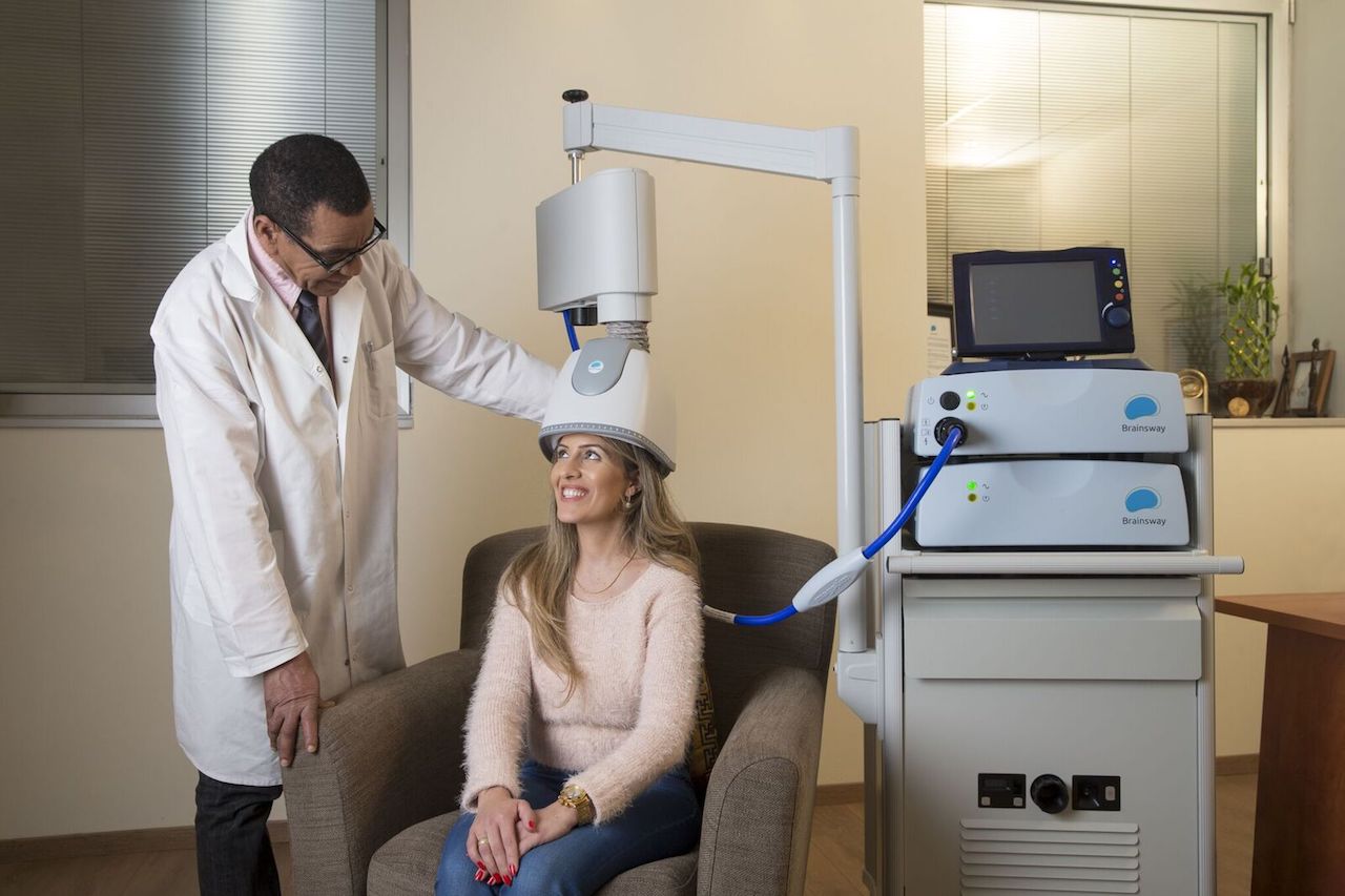 girl receiving TMS therapy