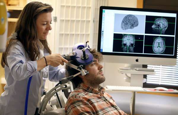 Doctor demonstrates TMS at Medical University of South Carolina (MUSC)
