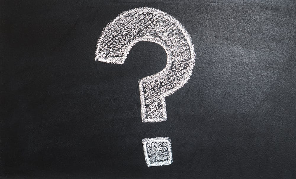a question mark drawn on a chalk board, indicating that tms therapy research is ongoing