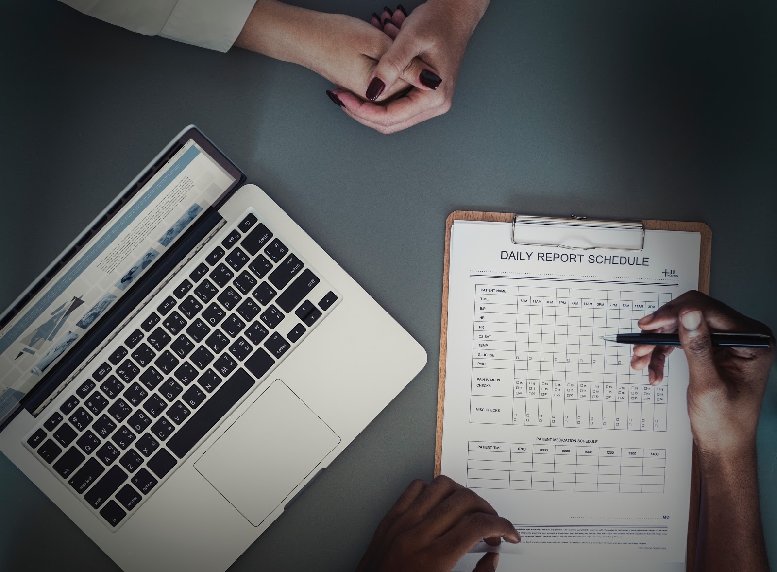 Doctor and patient going over a daily report schedule