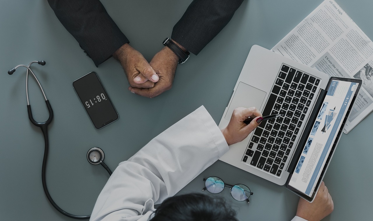 patient and doctor at computer